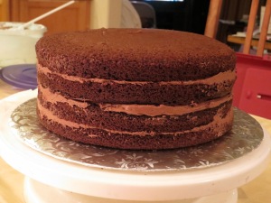 Four chocolate cake layers filled with chocolate buttercream