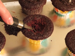 Hollow out the middle of the cupcake.