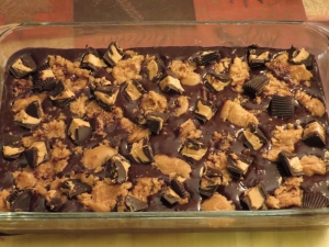 Chopped peanut butter cups on brownie dough