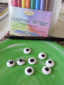 Purchased candy eyes. Lashes added with edible marker.